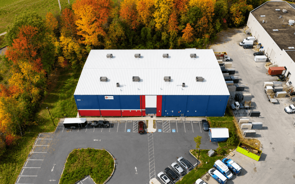 Gymnasium metal roof restored with white acrylic coating